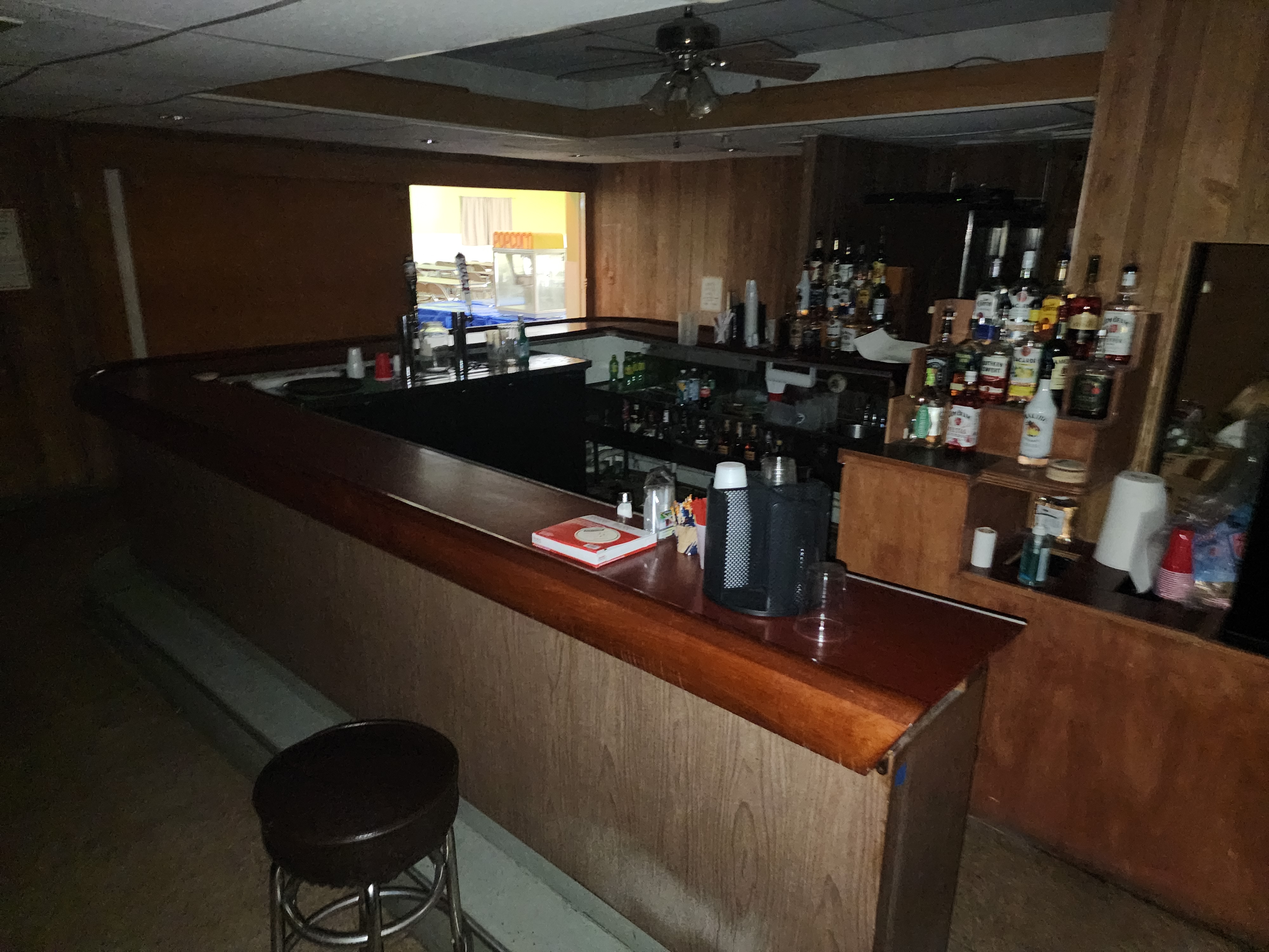 Looking along the bar and through the serving hatch into the hall beyond