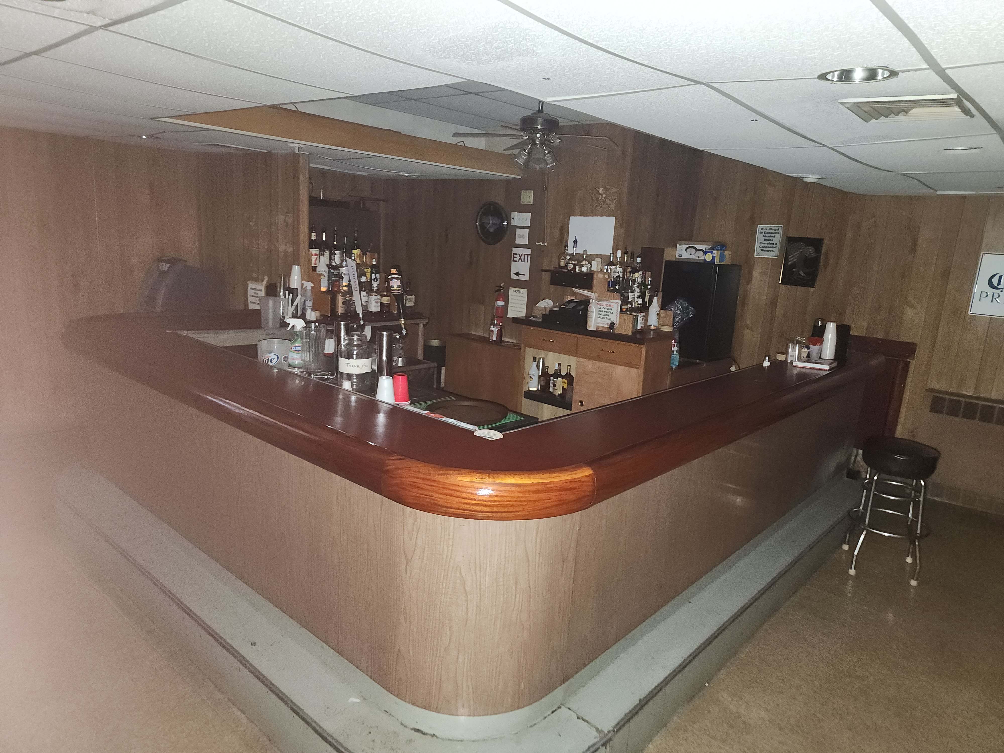 The wood-panelled bar in the lower level, seen from the room