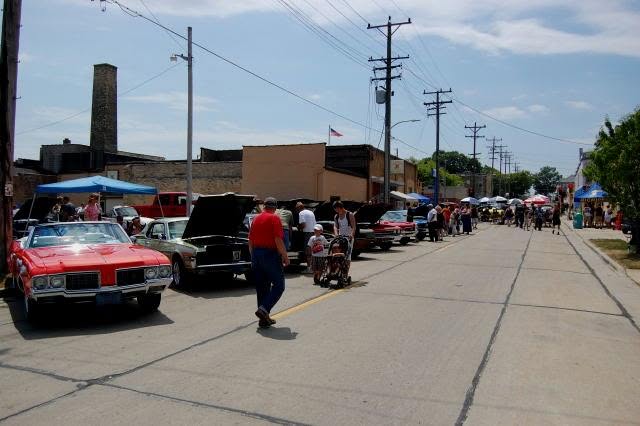 Classic cars lining the street outside the club during a neighbourhood car show